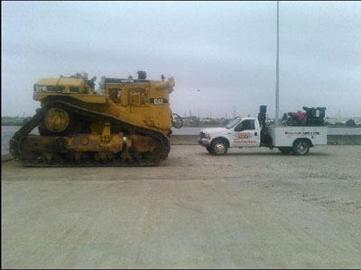 Export Logistics & Shipping, Inc. internationally transports Cat D11R heavy machinery to Hong Kong